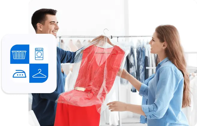 Customer receiving a freshly dry-cleaned red dress from laundry service staff inside a modern cleaning shop.